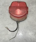 1974 Kawasaki F7 175 Taillight Lamp Assembly 23027-1018. Fixed Price $75.00.
