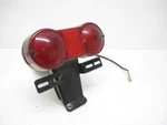 75 Suzuki Gt 550 Triple Tail Light And Mount 35710-33111 1974-1976. Fixed Price $93.75.