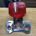 Honda Cb Rear Tail Light And Mount Bracket HM-17RC. Fixed Price $42.00.