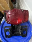 Tail Light Housing And Bracket 1971 Honda Scrambler. Fixed Price $10.00.