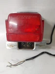 1983 Suzuki GS850GL Brake Light Tail 35720-49130-999 (cracked). Fixed Price $12.99.