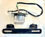 1984 Honda Elite CH125 License Plate Light & Bracket 33720-KJ9-003 84701-KJ9-670. Fixed Price $26.49.