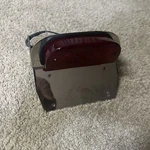 Rick Doss Taillight License Plate Frame Harley 9 Wide Fatbob Bobtail Daytec. Fixed Price $169.99.
