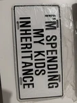 Funny Retired Senior I'm Spending My Kids Inheritance Booster License Plate. Fixed Price $13.00.