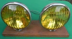 Nos Pair Deluxe Unity Ford Script Fog Lights. Fixed Price $300.00.
