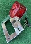 1970S Oem Honda CB125 Rear Tail Brake Light W/ Plate Mount Bracket. Fixed Price $118.75.
